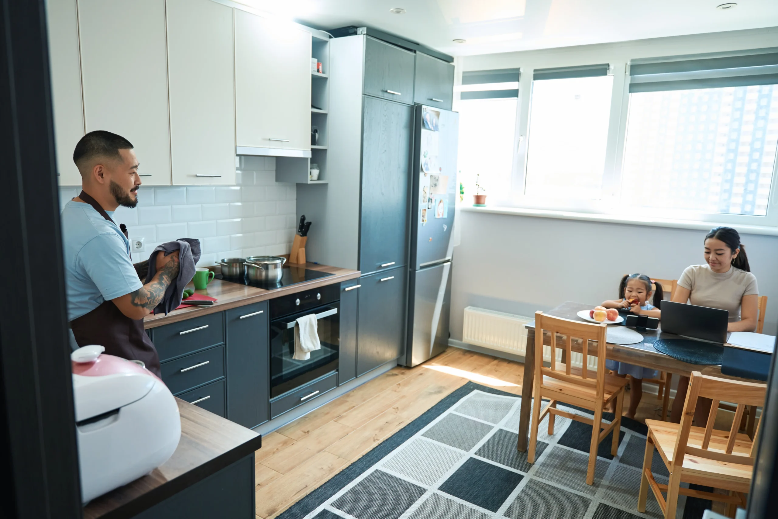 smiling-man-with-kitchen-towel-in-his-hands-stands-2024